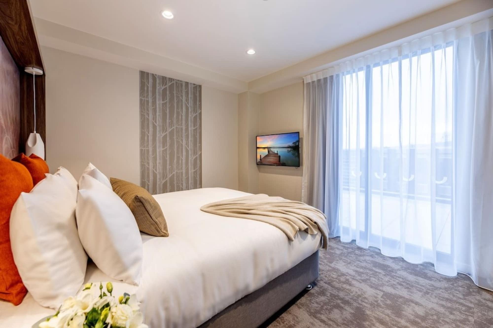 Sudima Christchurch City Kültér fotó A bedroom at the hotel